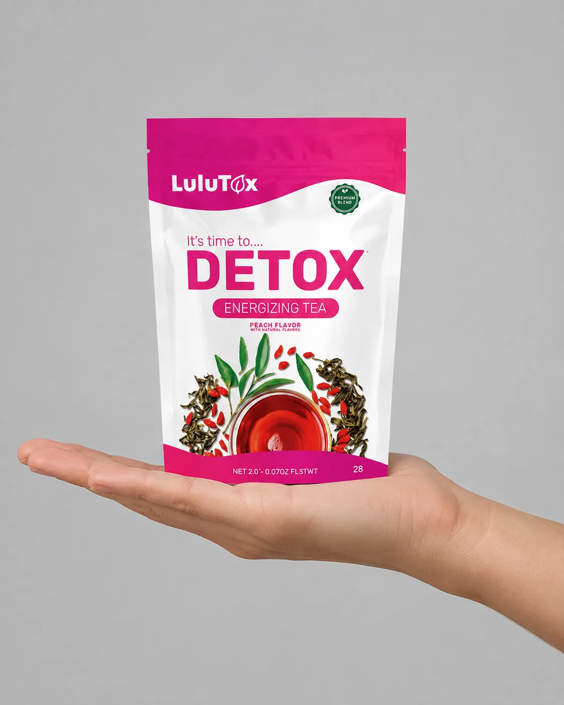 Lulutox Detox Tea HCTC — the package held in a hand